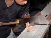 Tea house carpenter Okino Shōta sawing. &copy; Ashmolean Museum, University of Oxford