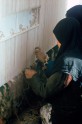 Weavers working on a vertical loom using a knot plan, Kerman, Iran, Photo by: May H. Beattie, 1970s. &copy; Ashmolean Museum, University of Oxford