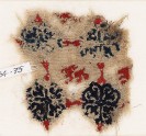 Textile fragment with lion and grid of quatrefoil flowers (EA1984.75)