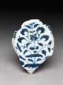 Base fragment with floral decoration in blue on white (EAP.379)