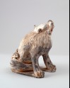 Figure of a lion scratching its head (LI1301.425)