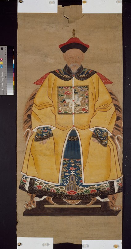 Man in the dress of an official of the sixth rankfront