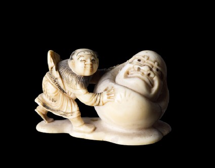 Netsuke in the form of a boy rolling a yuki daruma, or snowmanfront
