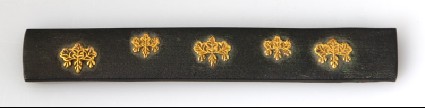 Kozuka, or knife handle, with mon made from kiri, or paulownia leavesfront