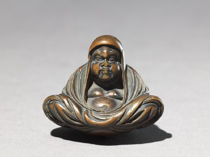 Netsuke in the form of Daruma meditatingfront
