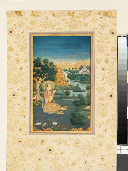 Woman doing puja in a landscapefront
