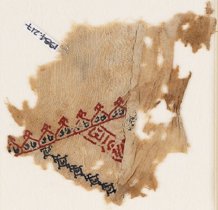 Textile fragment with linked crenellations and inscriptionfront