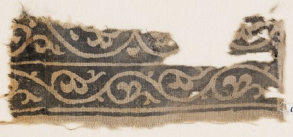 Textile fragment with vine and leavesfront