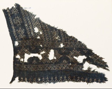 Textile fragment with geometric patterns, diamond-shapes, and zigzags made of dotsfront