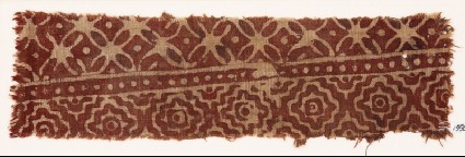 Textile fragment with interlocking diamond-shapes and quatrefoilsfront