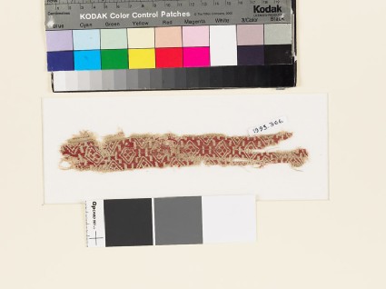 Textile fragment with band of linked diamond-shapesfront