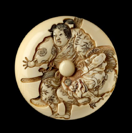 Manjū netsuke depicting Minamoto Yoshitsune practising martial arts with a tengu demonfront