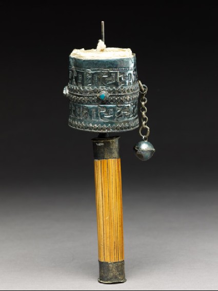 Prayer wheel containing scrollsside