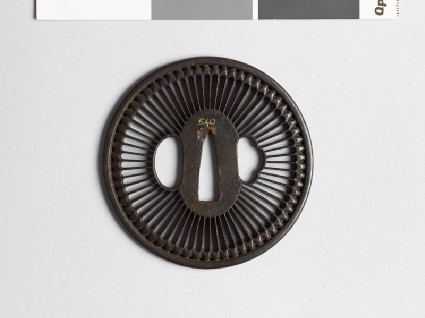 Round tsuba with chrysanthemum floretsfront