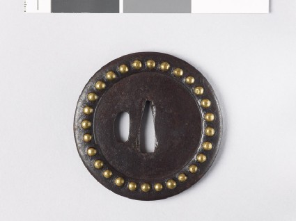 Round tsuba with brass studsfront