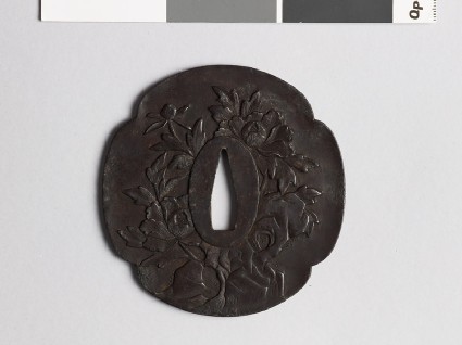 Mokkō-shaped tsuba with peony growing from a rockfront