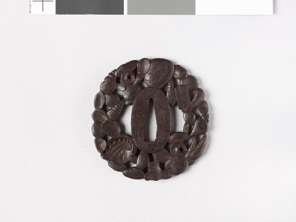 Tsuba in the form of overlapping sea shellsfront