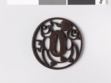 Round tsuba with tama, or sacred jewelsfront