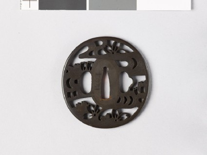 Tsuba with cherry blossoms floating on waterfront