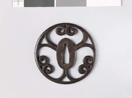 Round tsuba with scrolling cuspsfront