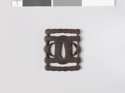Tsuba in the form of a silk winder with skeinsfront
