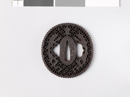 Tsuba with dragons and shippō diaper of interlaced circlesfront