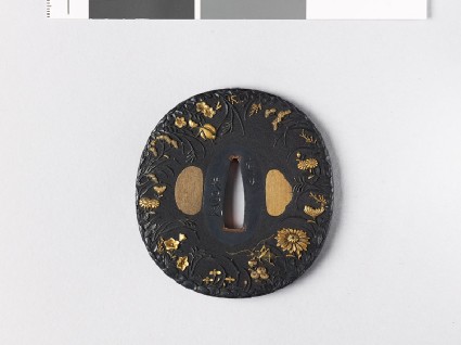Lenticular tsuba with grasshopper, crickets, and autumn plantsfront