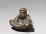 Netsuke in the form of Daruma meditating (side)