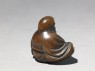 Netsuke in the form of Daruma meditating (side)