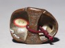 Netsuke in the form of a hyottoko mask (back)