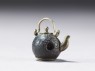 Ojime in the form of a kettle (side)