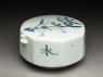 Blue-and-white water-dropper with foliage spray (oblique)