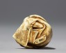 Netsuke in the form of a Nō actor wearing a mask (bottom)