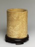 Ivory brush pot with figures in a landscape (oblique)