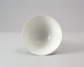 White ware bowl with three boys among foliage (oblique)
