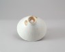 White ware bowl with three boys among foliage (oblique)