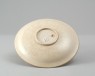 Dish in the style of Ding ware with floral decoration (oblique)
