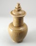 Greenware funerary vase with floral decoration (oblique)